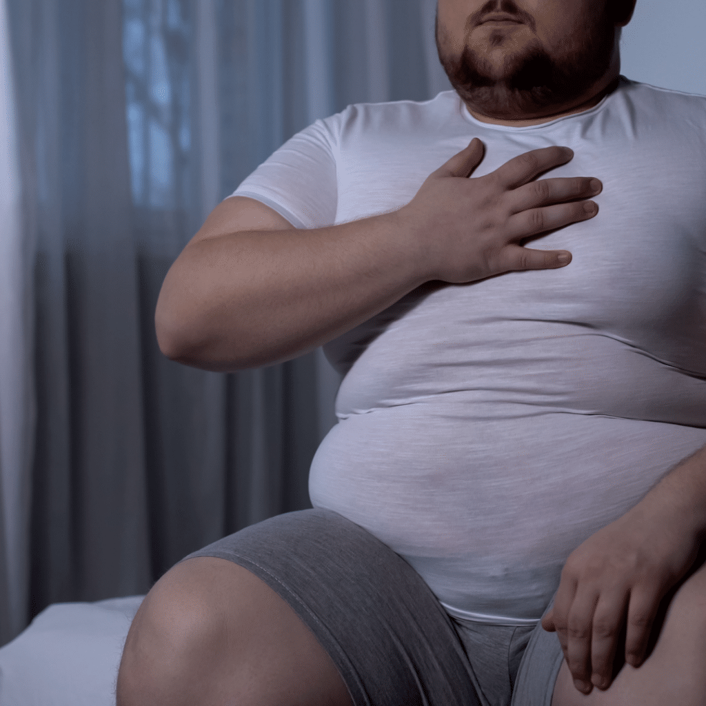 Obese man with heartburn